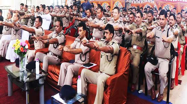 International Yoga Day- ITBP officials practicing yoga in uniform, boot and belt on waist