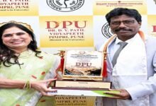 Prof Divakaran Honoured at AIU Pune Event